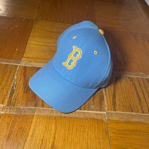 zephyr light blue and gold UCLA flex fitted cap.
